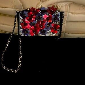 Women’s purse Free People crossbody, multi colored illumining burgundy.